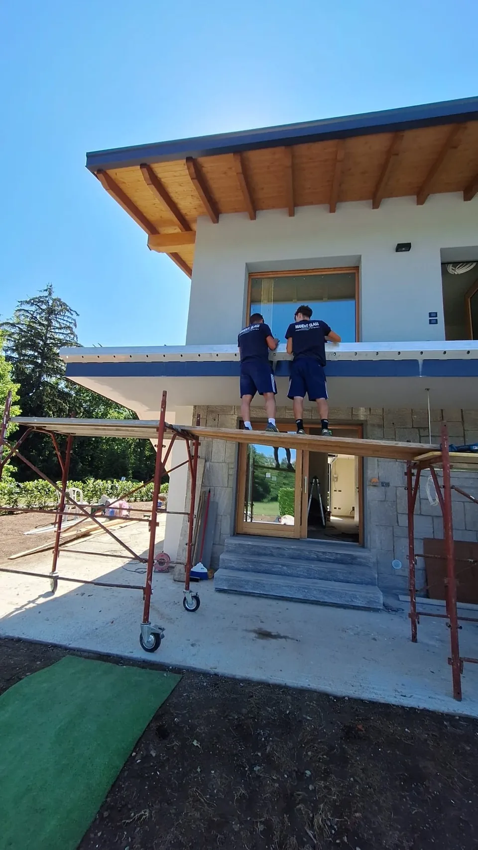 Workers installing the cornice