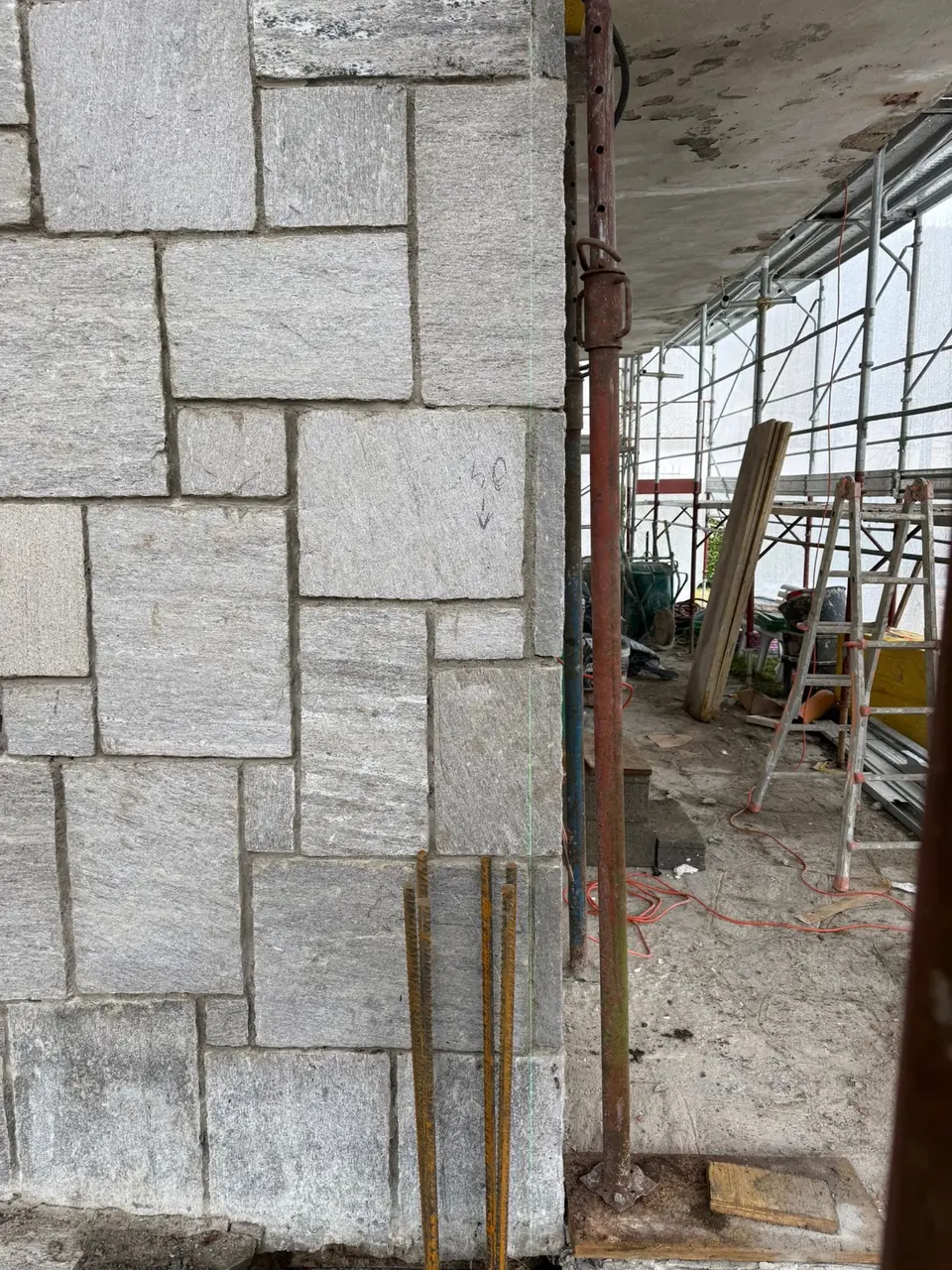 Stone cladding on a facade being installed